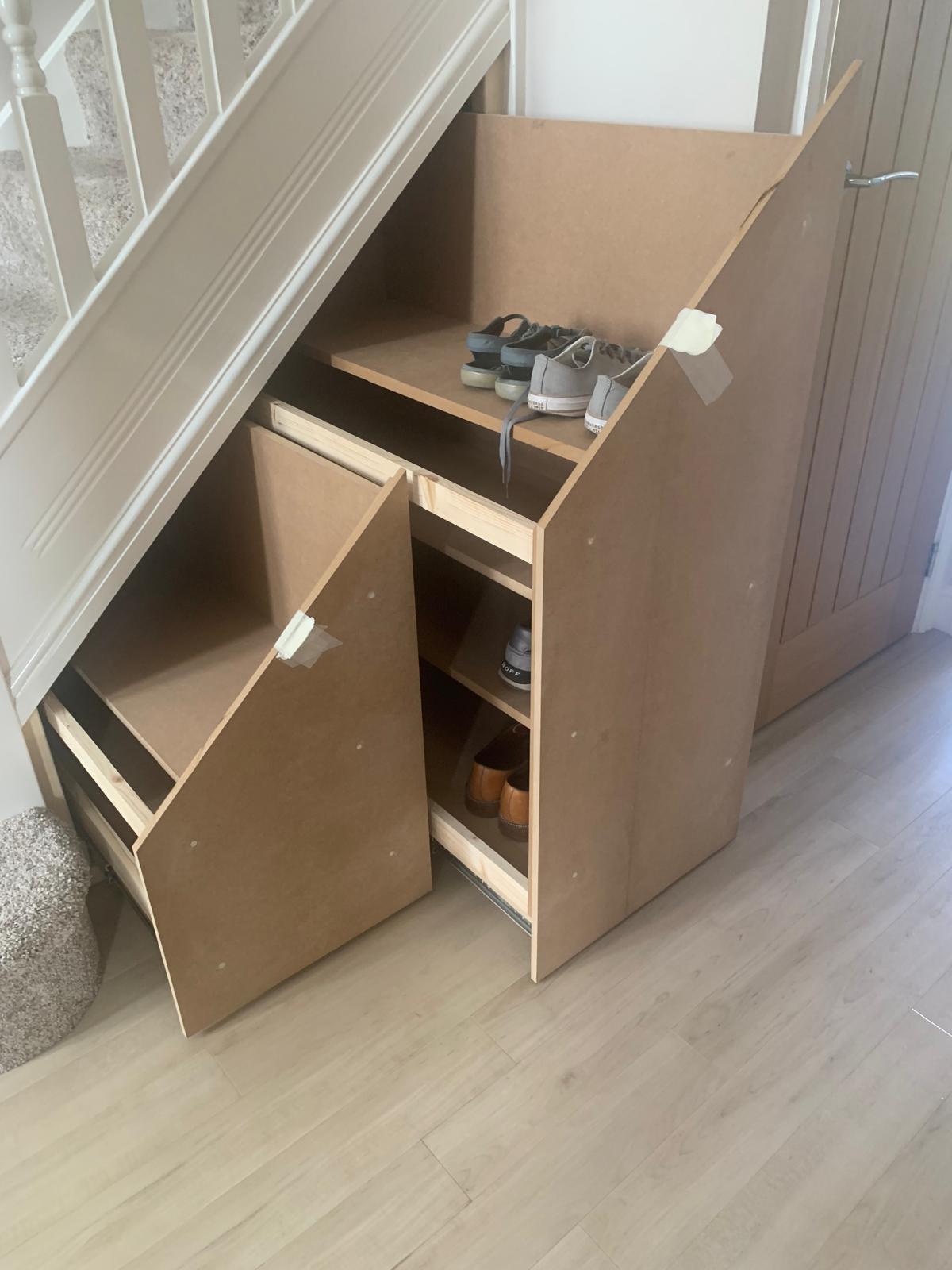 Under-stairs cupboards open